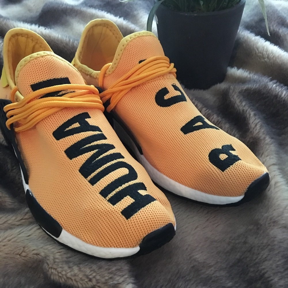 Human race yellow running shoes